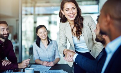 Cropped shot of two businesspeople shaking hands during a meeting in the boardroom